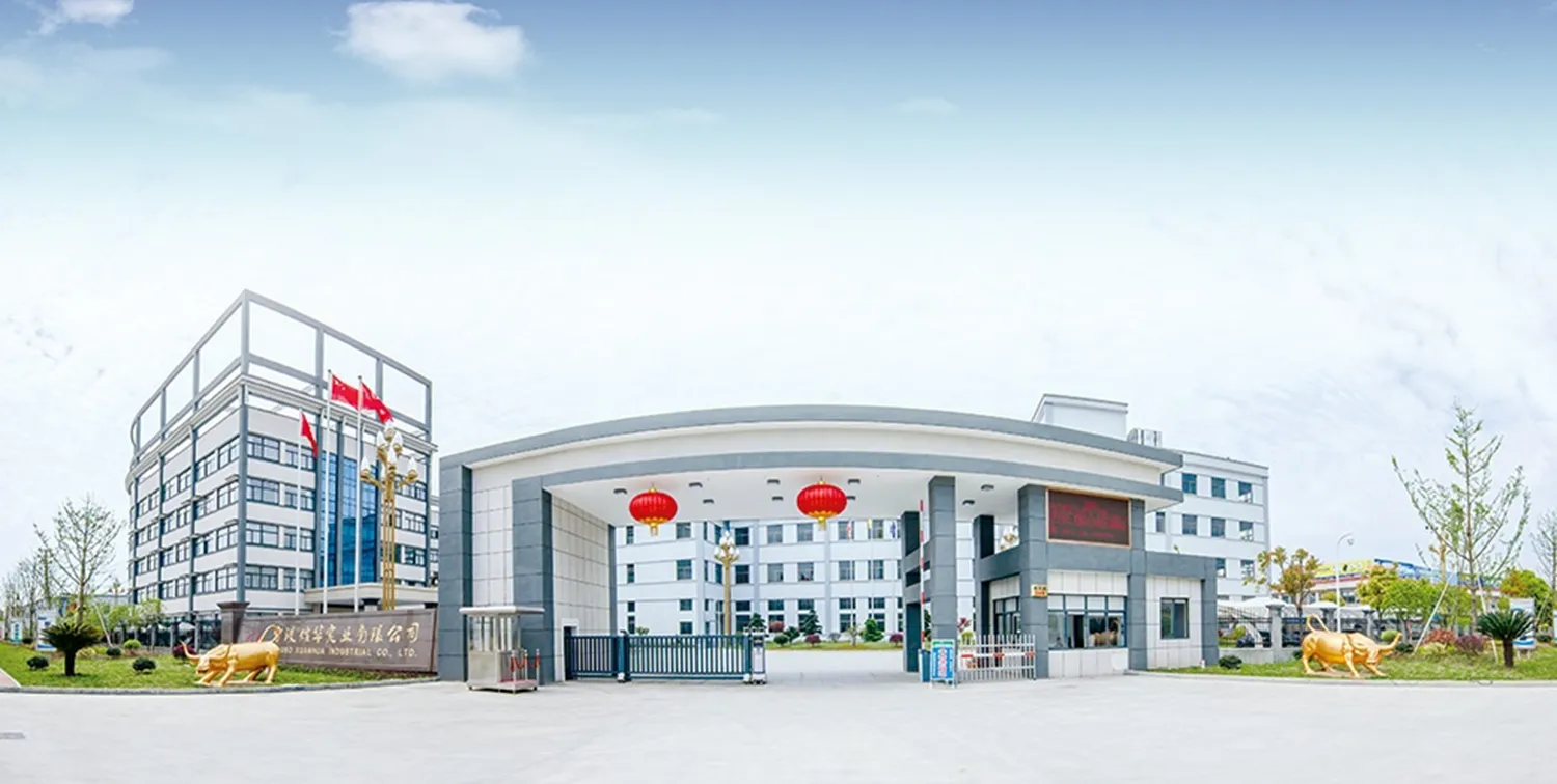 宁波煊华实业有限公司正门入口，大门配红灯笼，办公楼前有金色牛雕塑，展现企业现代化与稳重形象